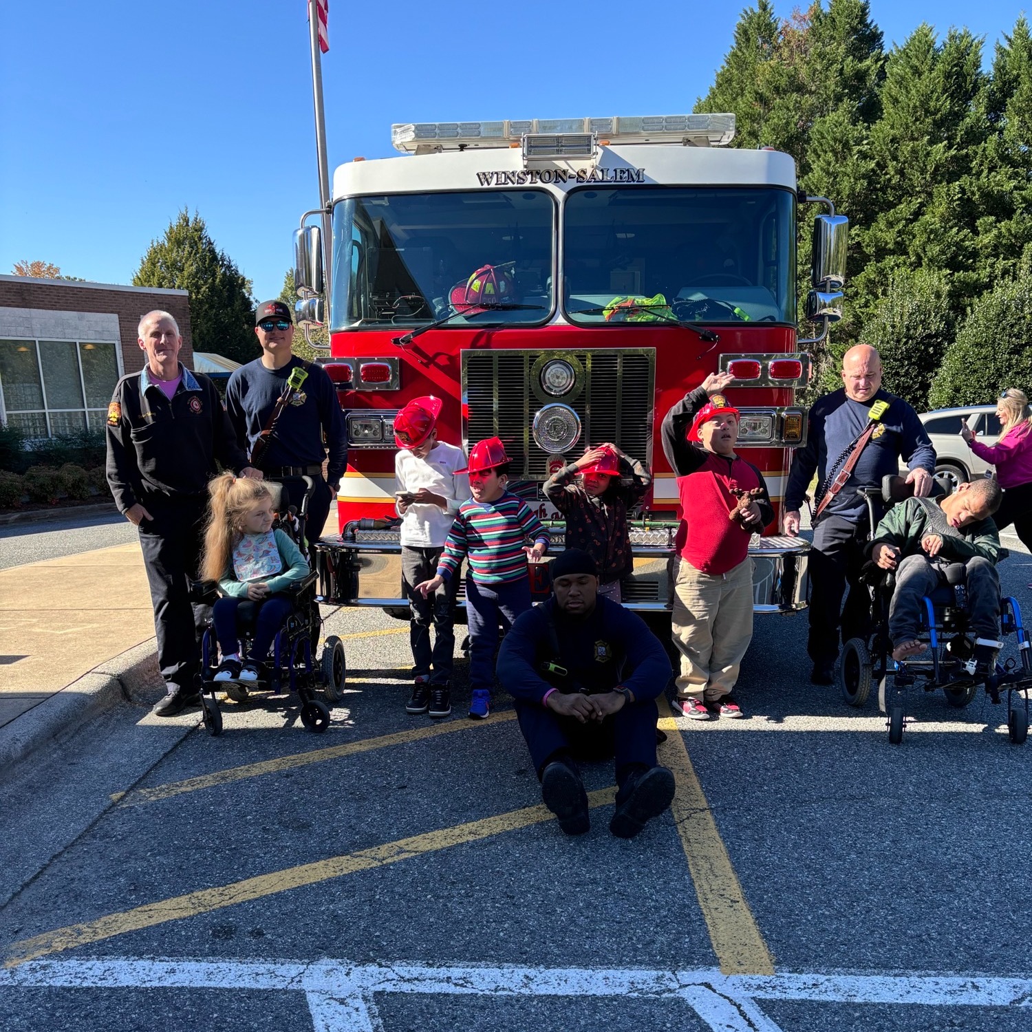 students posing in front of fire truk