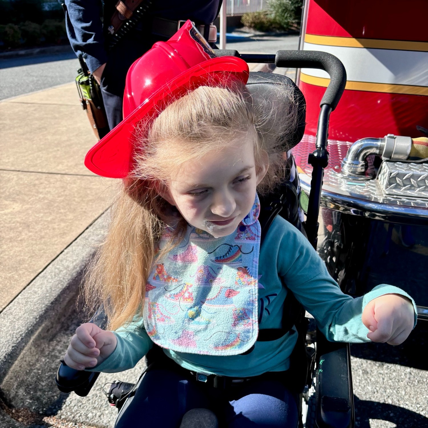 student in wheel chair at firetruck
