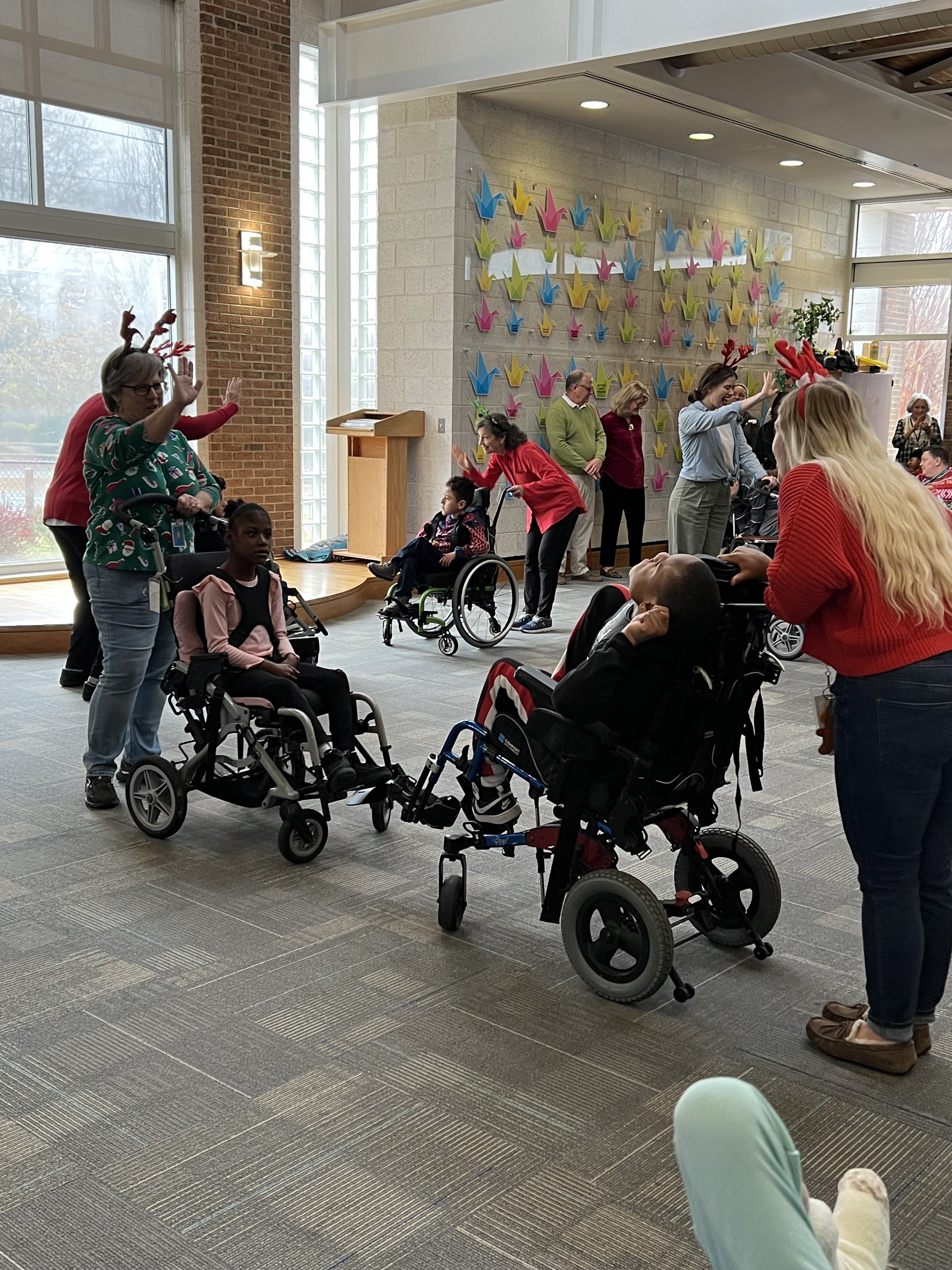 students and staff participating in reindeer dance
