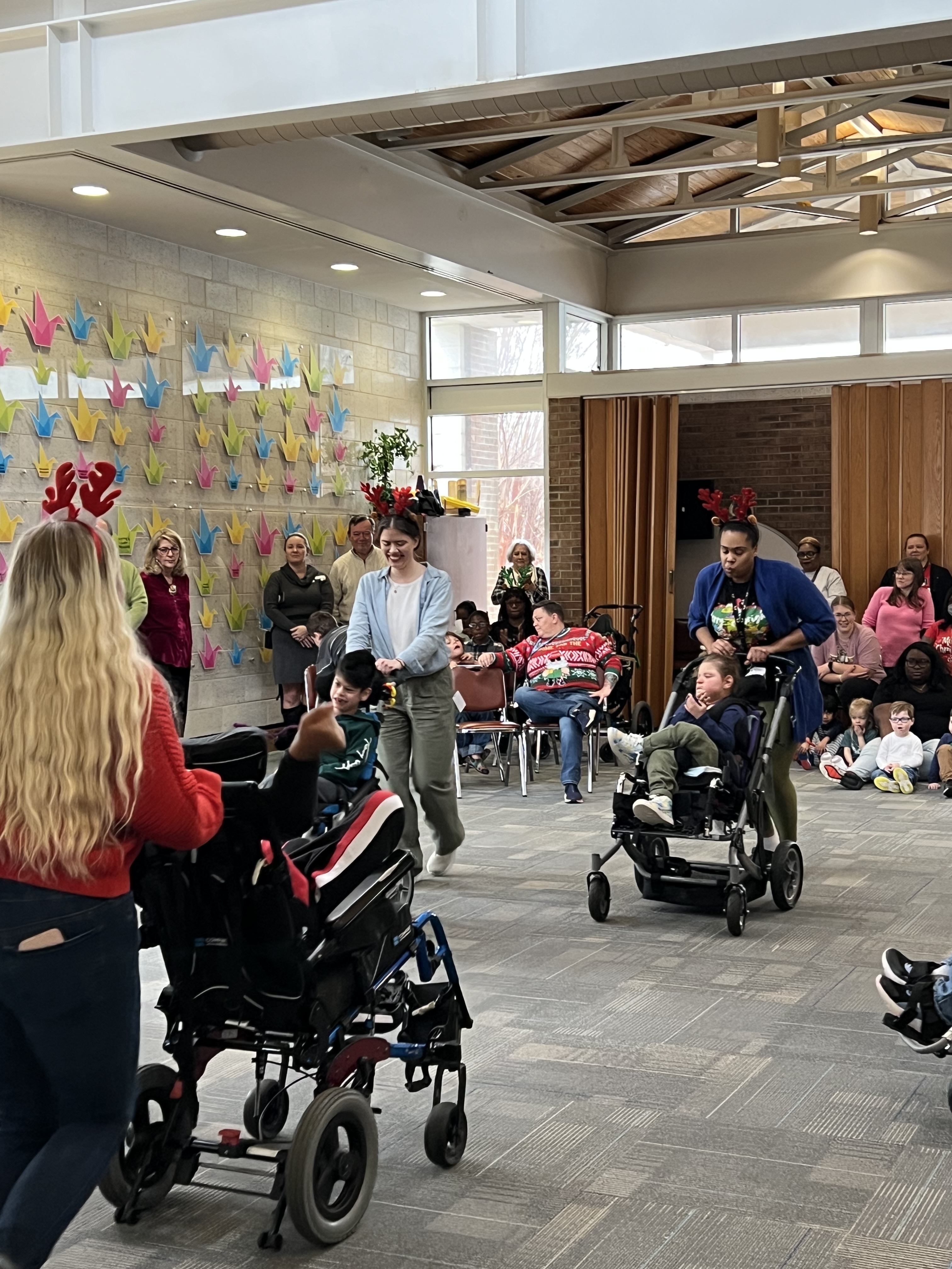students and staff participating in reindeer dance