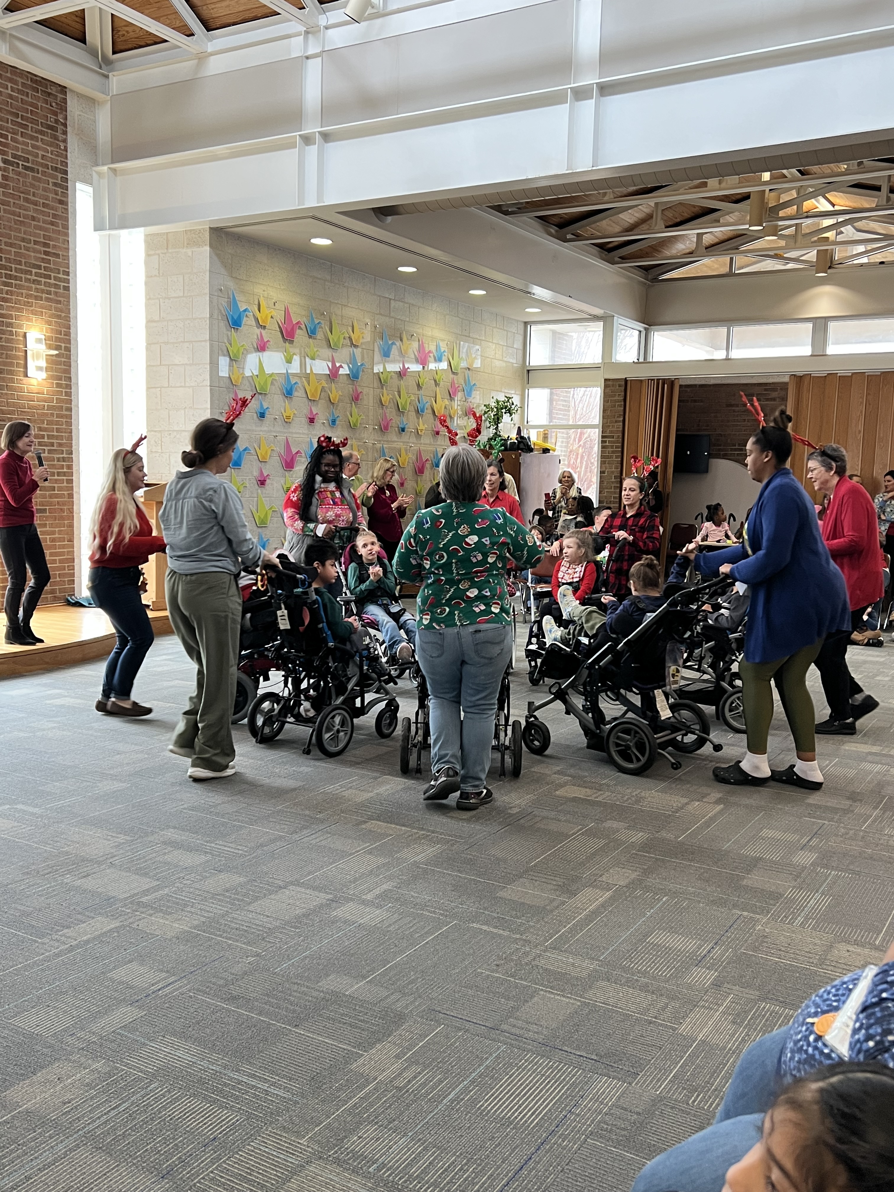 students and staff participating in reindeer dance