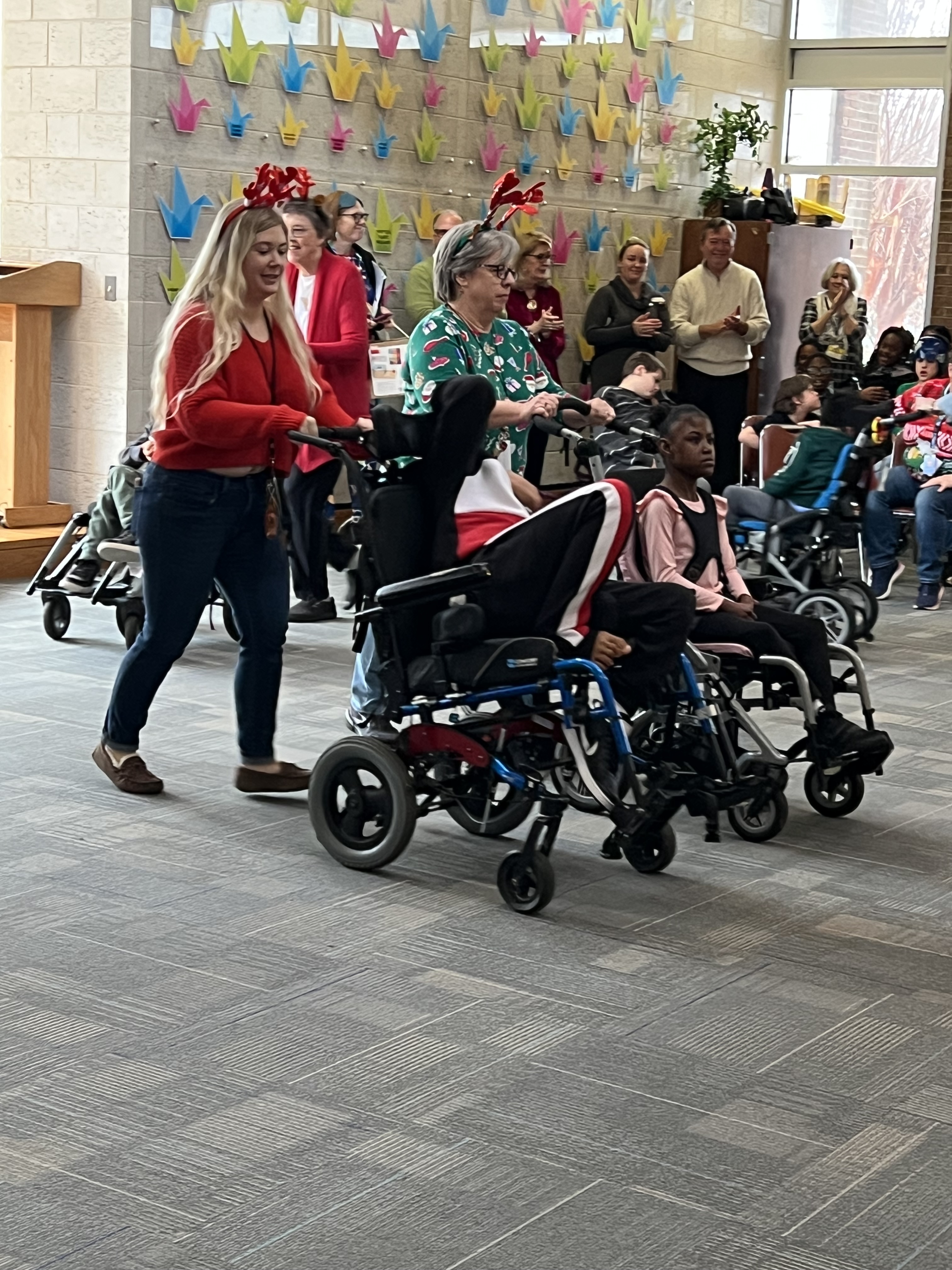 students and staff participating in reindeer dance