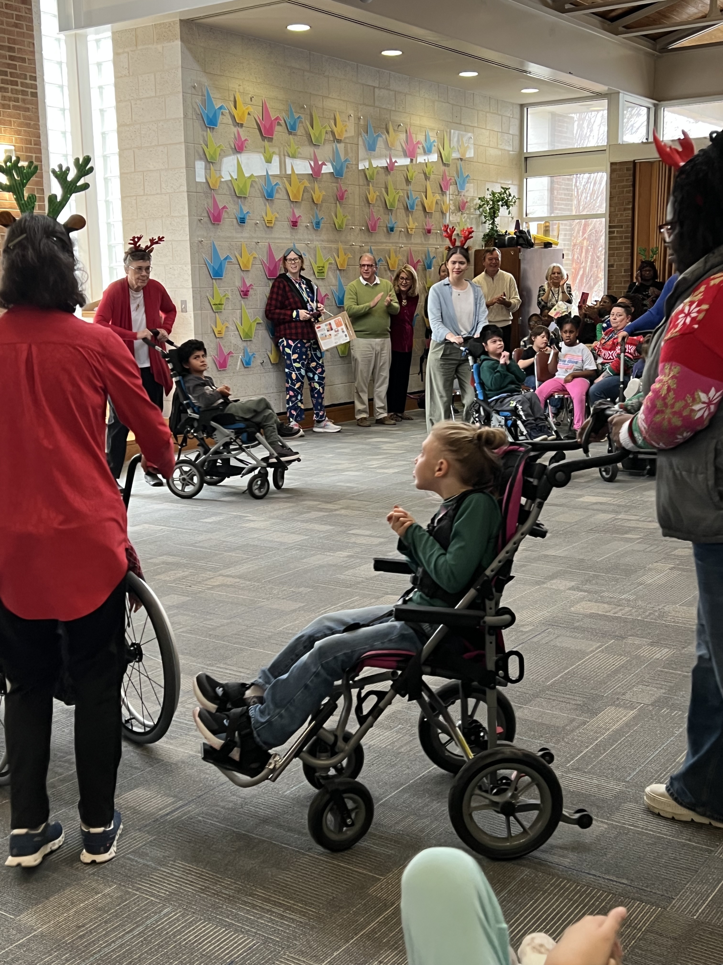 students and staff participating in reindeer dance