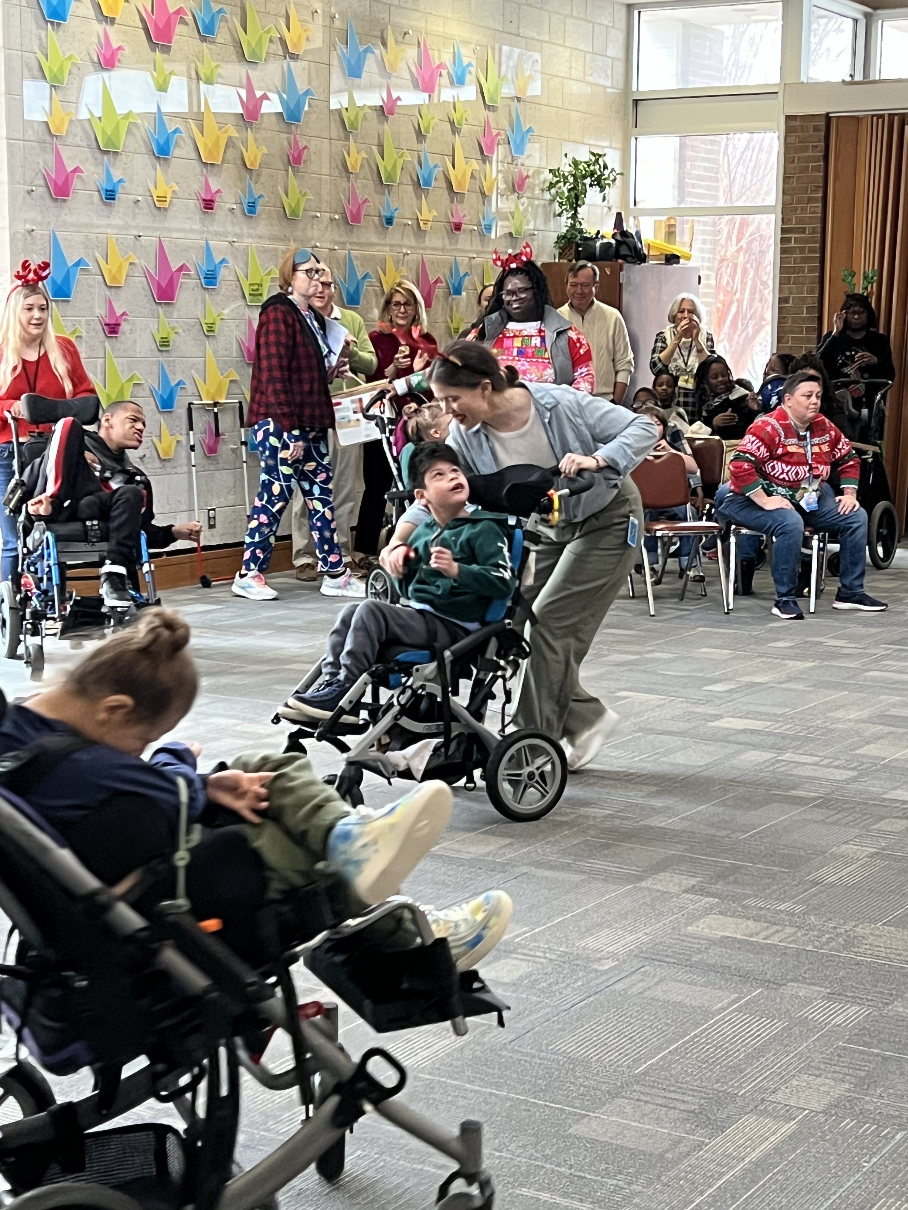 students and staff participating in reindeer dance