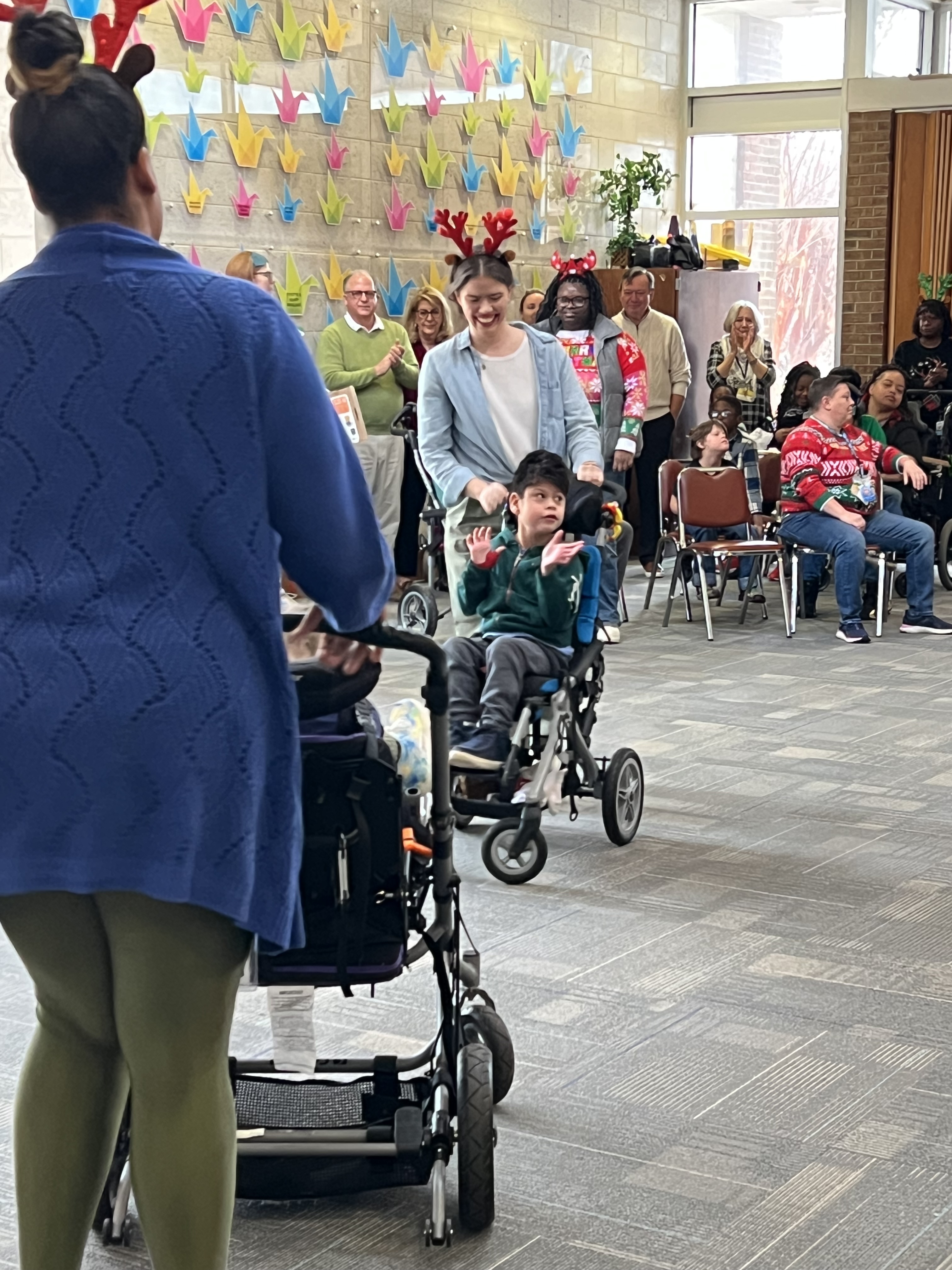 students and staff participating in reindeer dance
