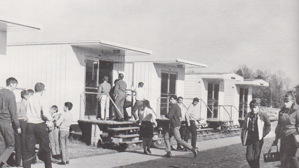 1971 black and white picture of people   in houses