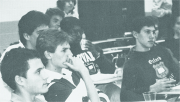 Black and white picture of students sitting at their class room