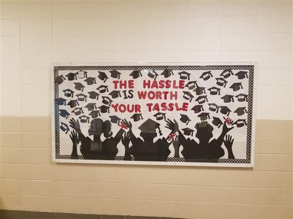 banner that says "The hassle is worth your tassle" created by students