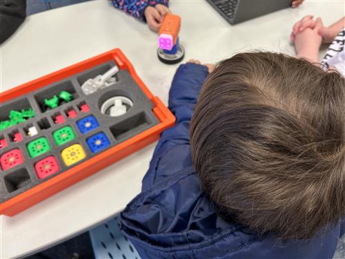 Kid working with a build kit