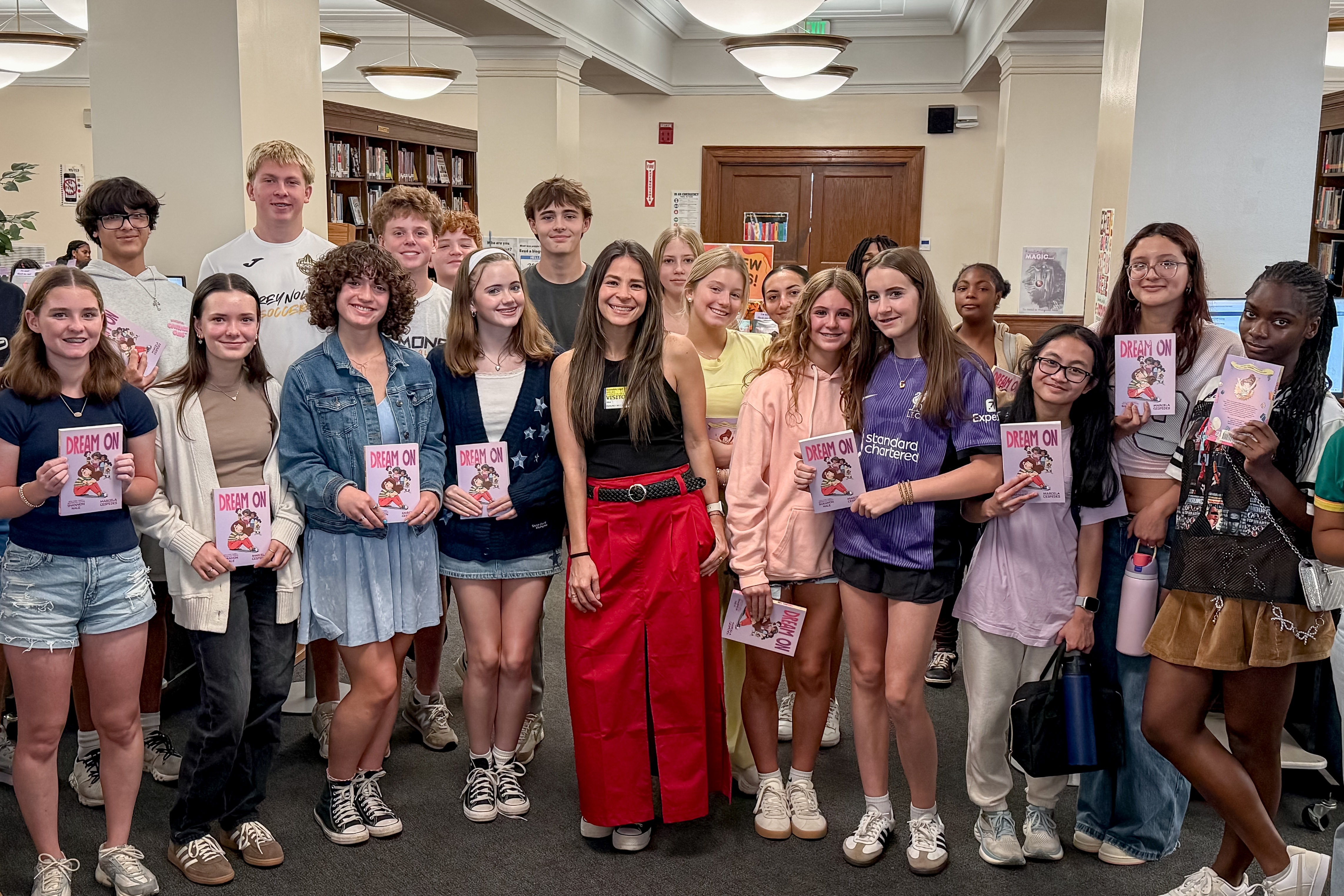 Students with illustrator and books