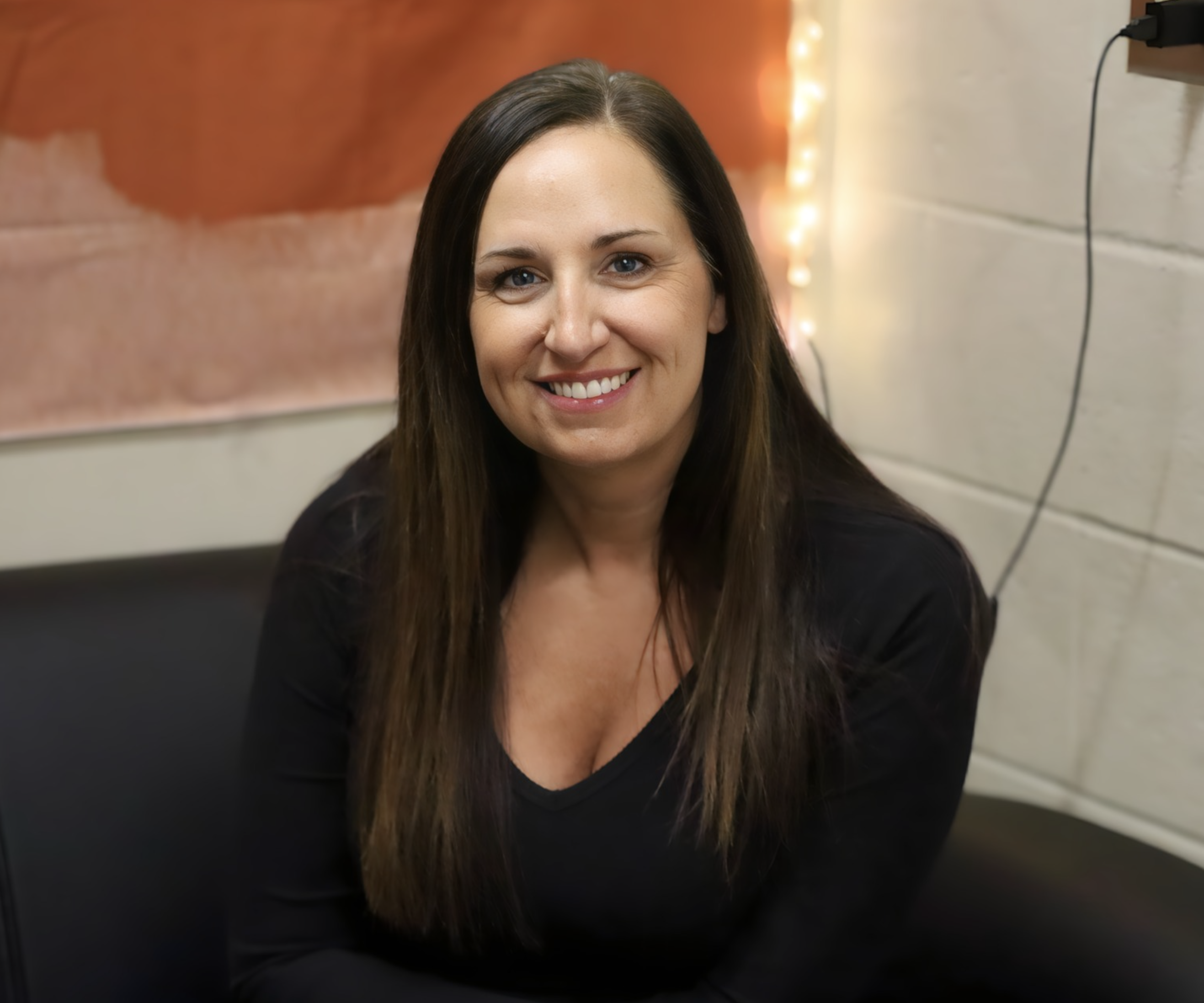 Andrea smiling at the camera.