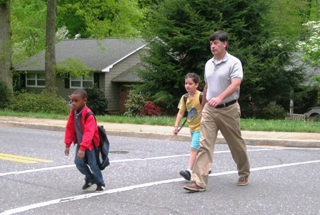 dad walking with kids