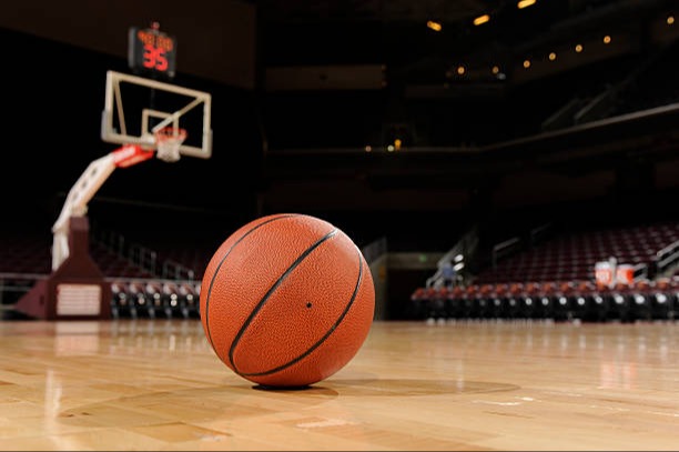 Basketball laying on a court