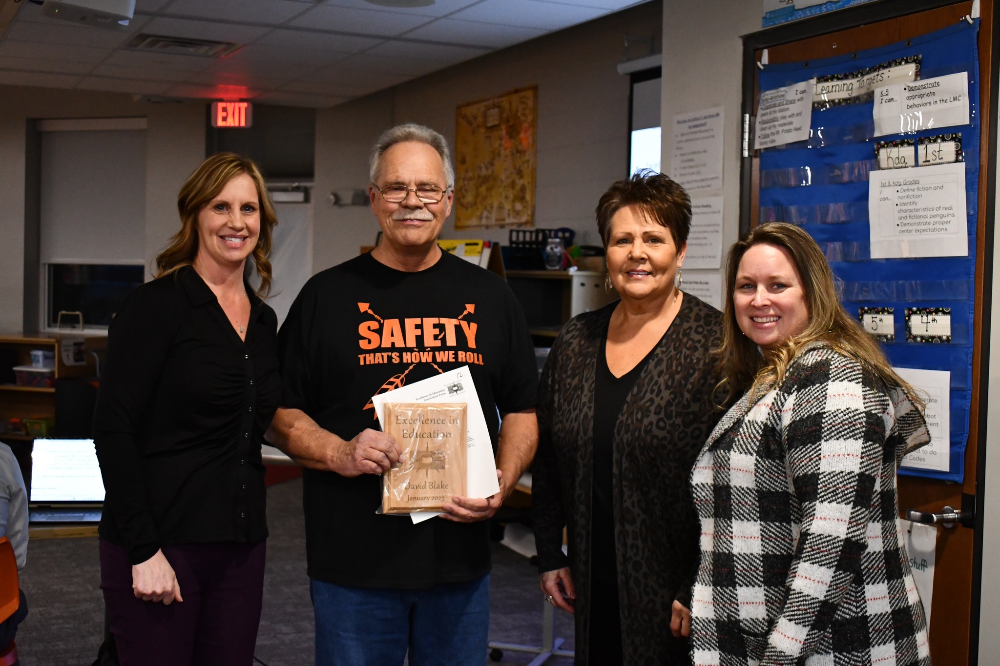 staff receiving an award