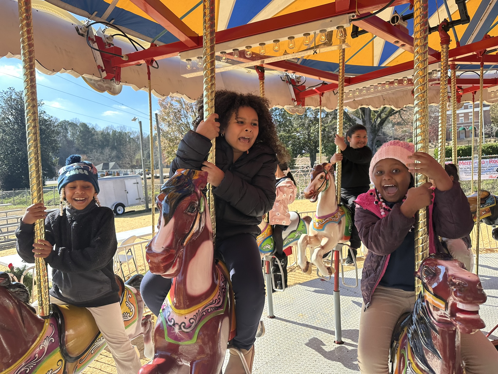 Students enjoying a field trip to the Merry Go-Round