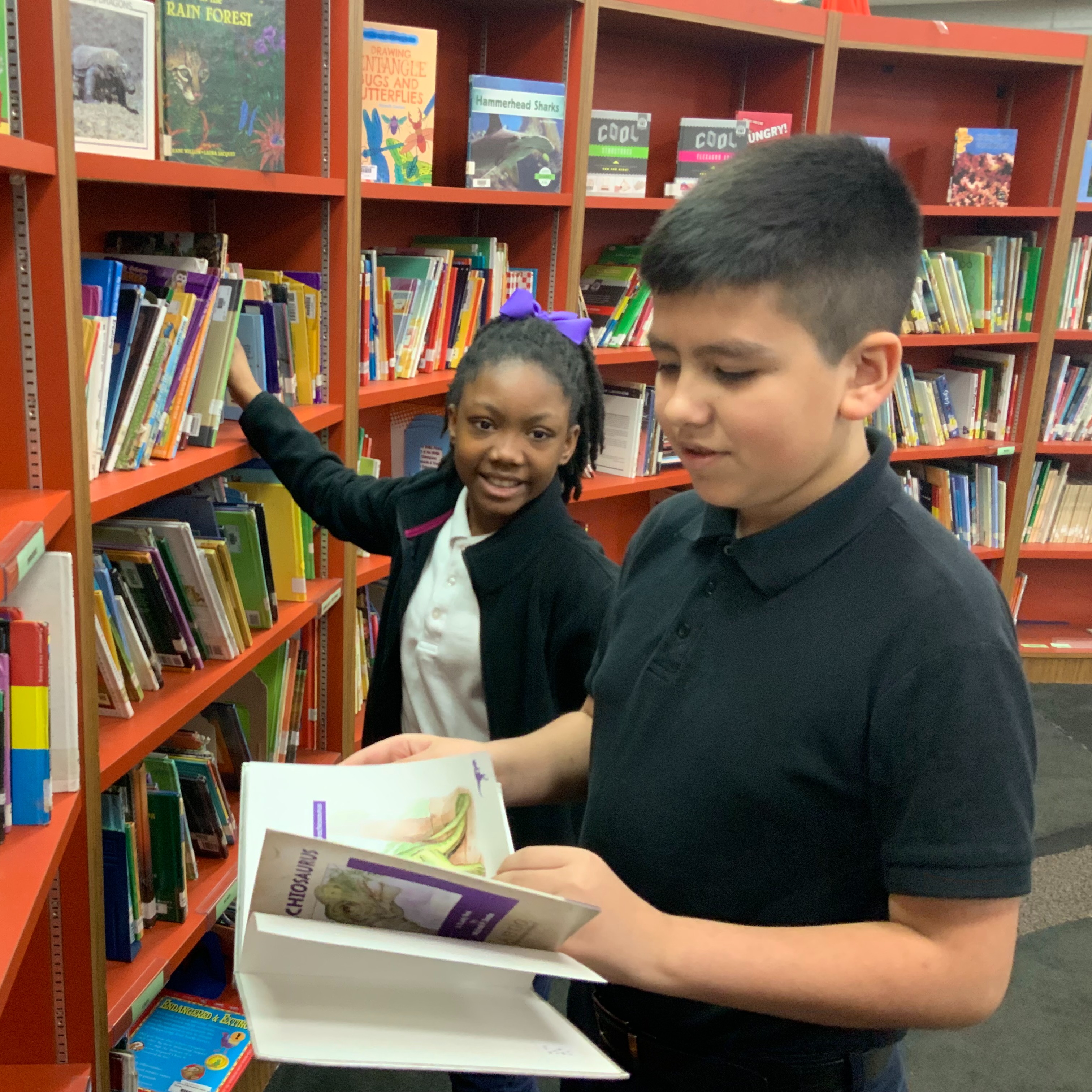 Students looking for a library book to check out.