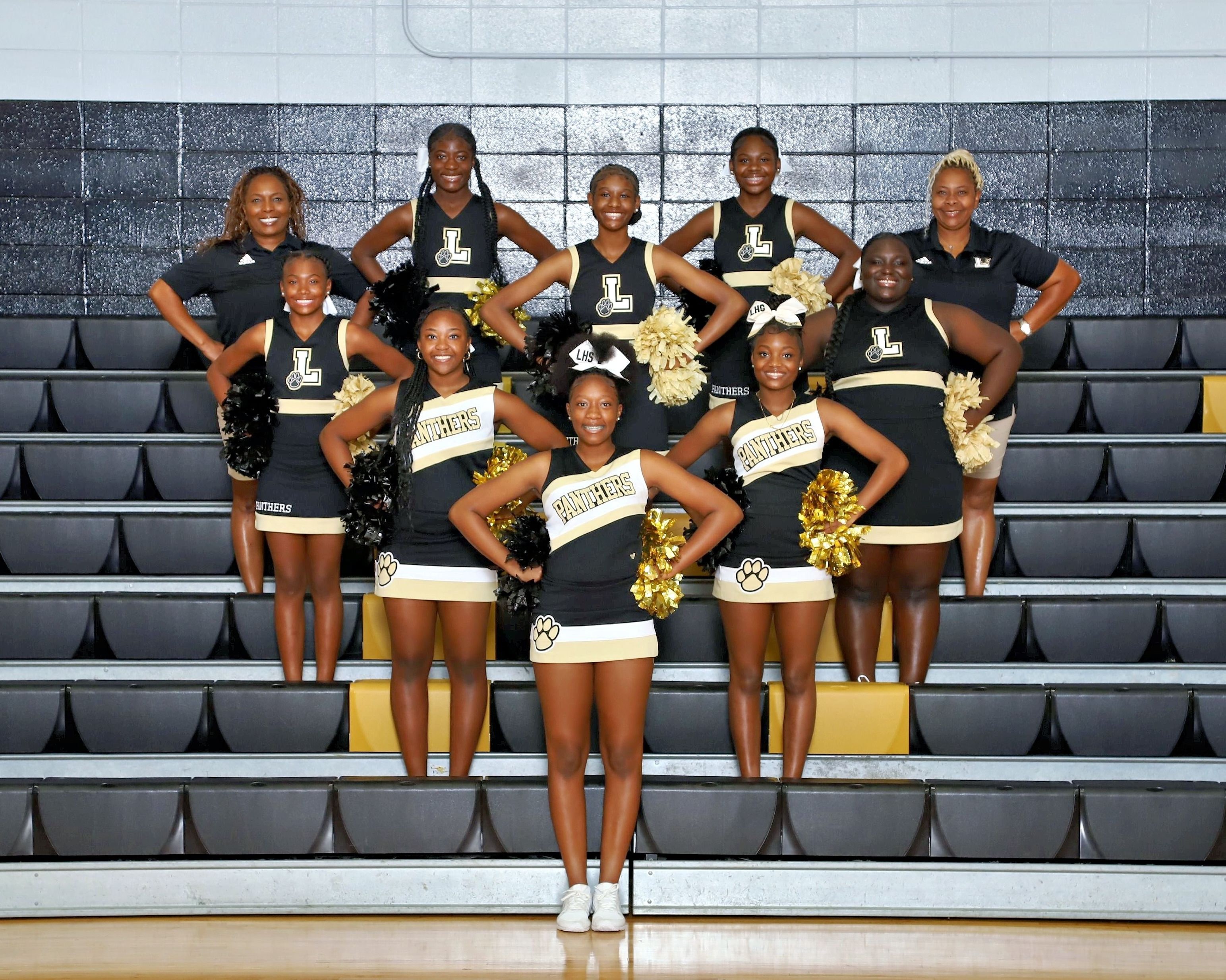 A photo of the cheerleaders with sponsor Jacinta Truitt