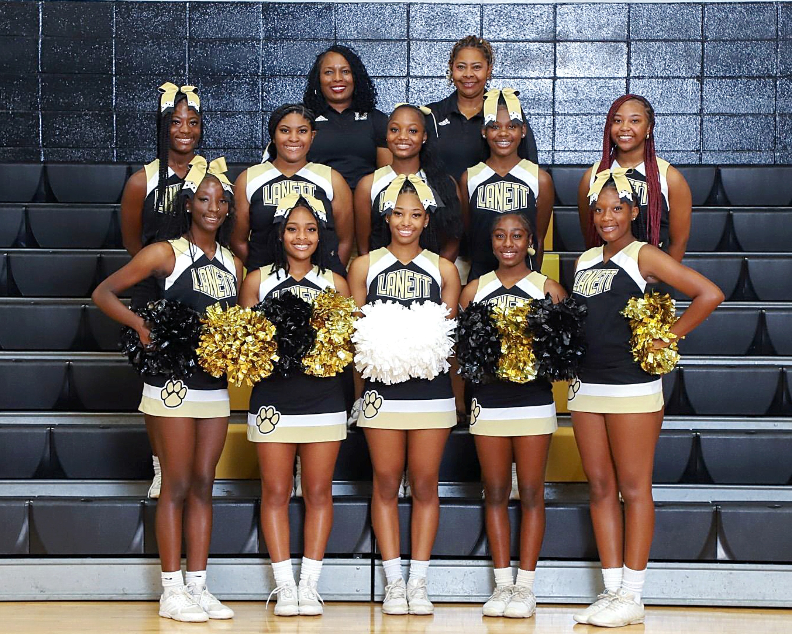 A photo of the cheerleaders with sponsor Jacinta Truitt