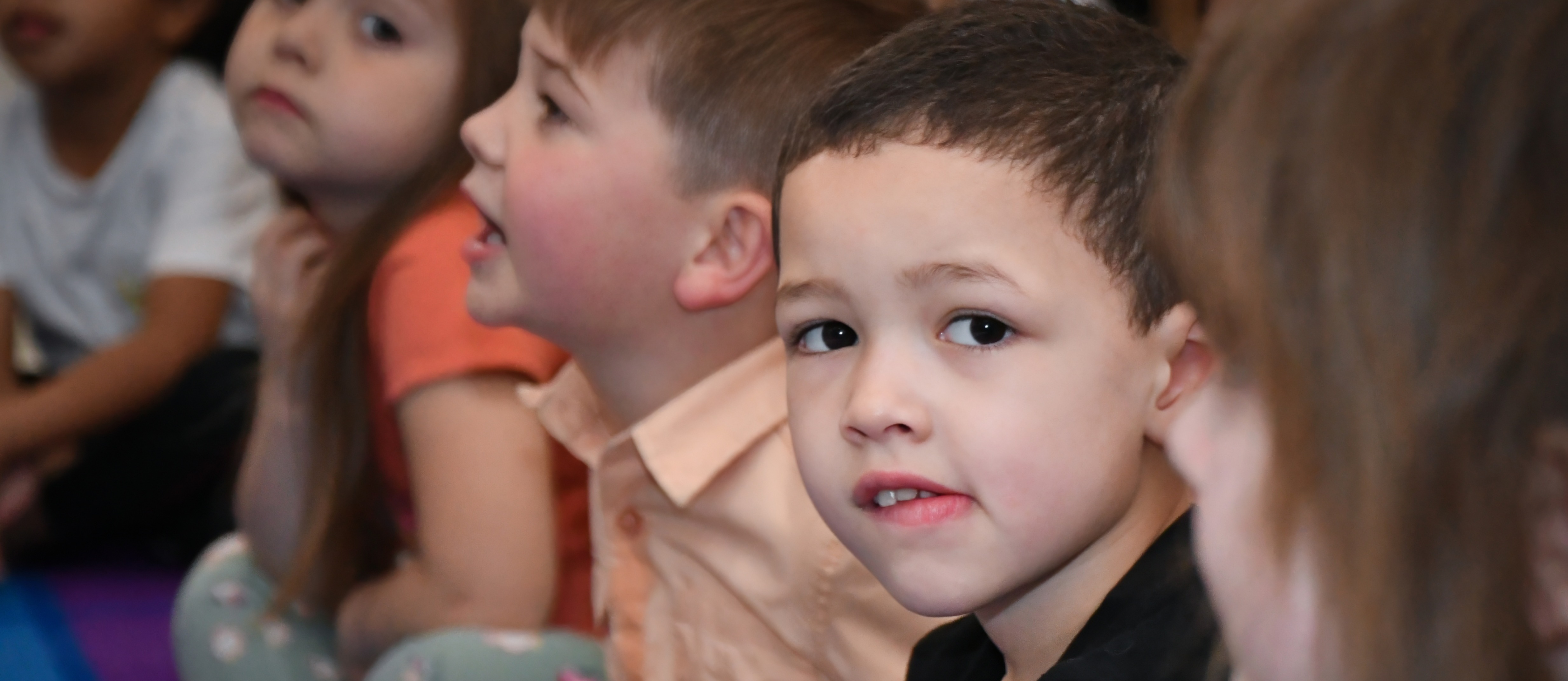 Mae Stevens Elementary students listen to a story