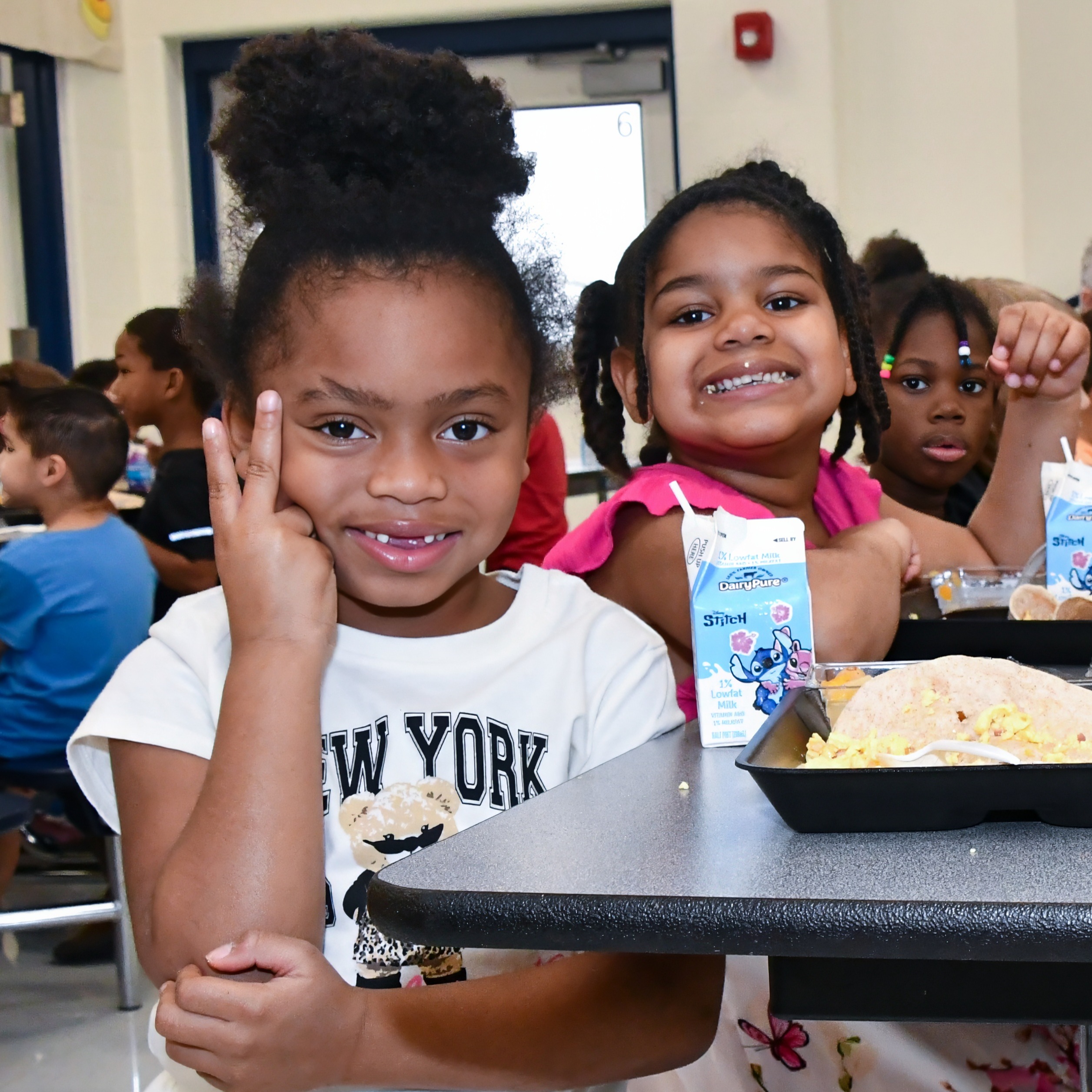Happy Pre-K students at a lunch table