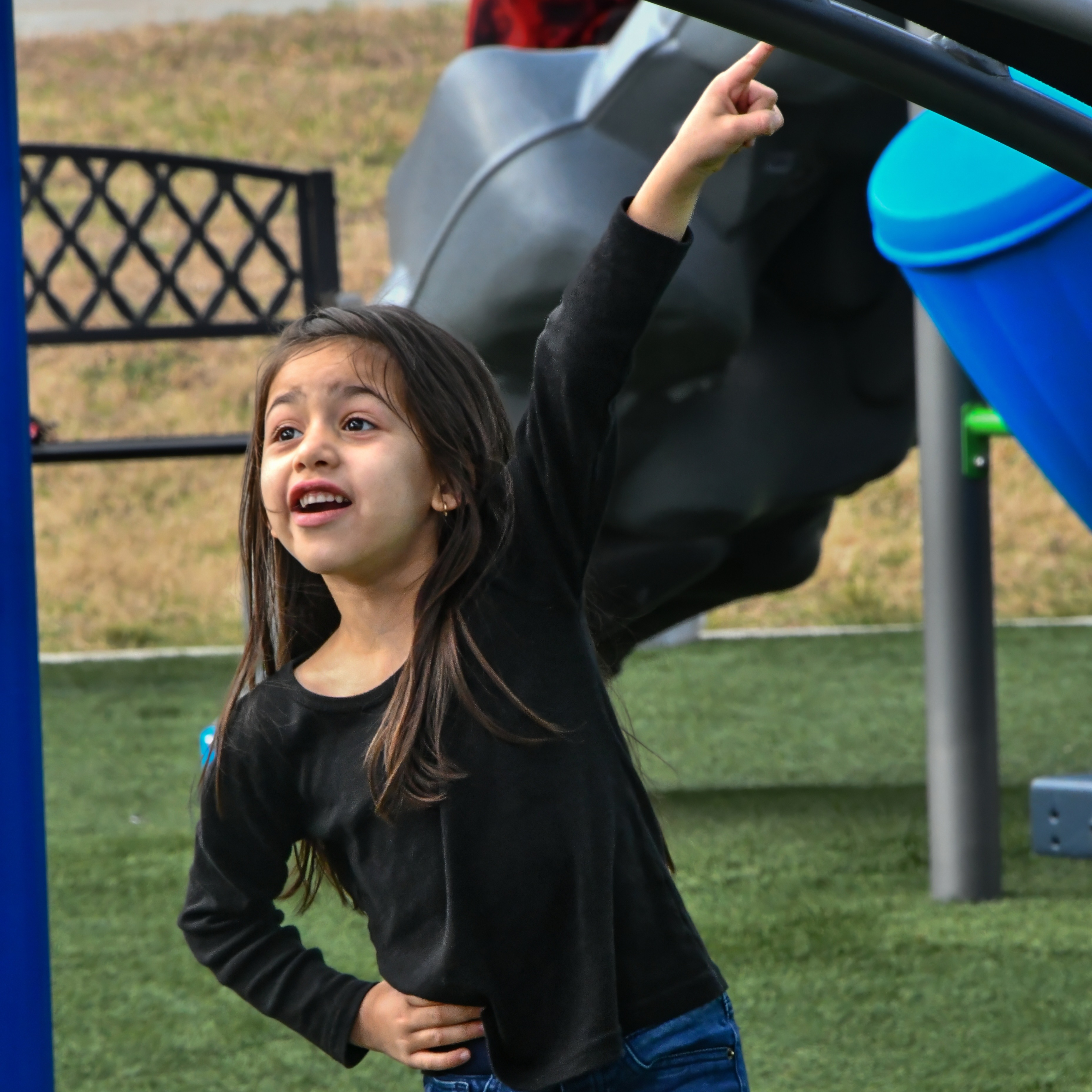 Pre-K student playing on a playground