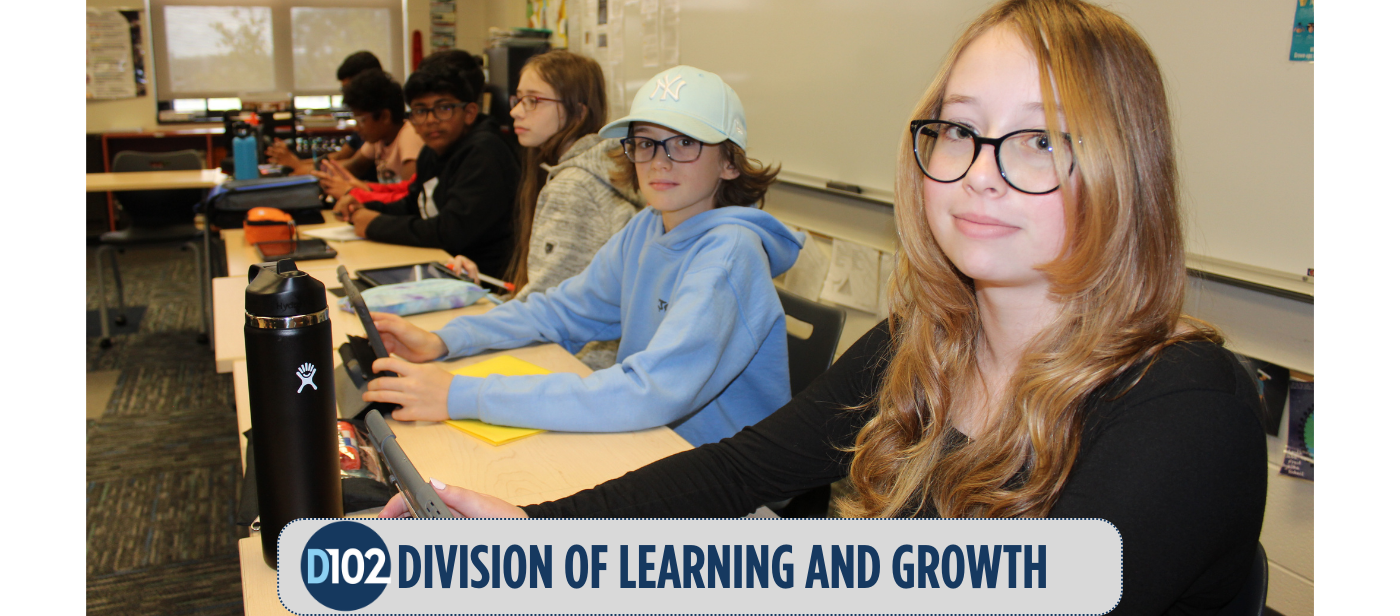 students seated on their desks looking at the camera, the image says division of learning and growth