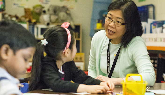 teacher talking to student