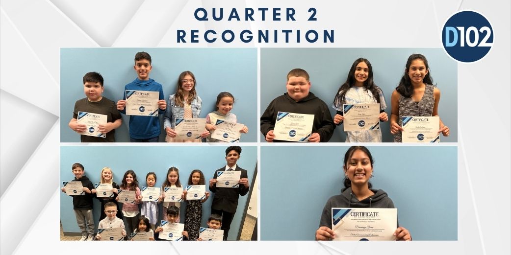 Students holding an award.