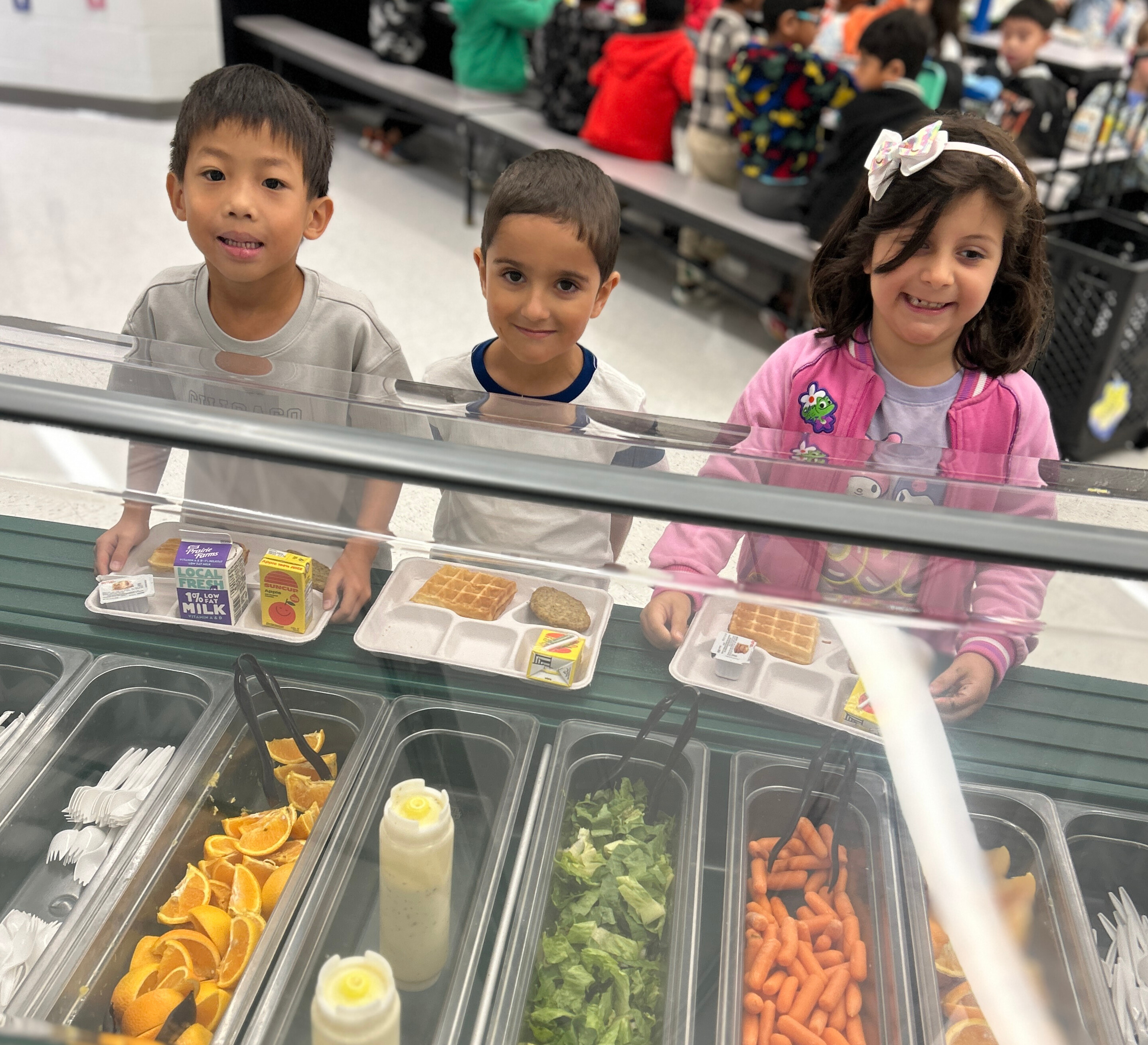 3 Kids with their meal trays