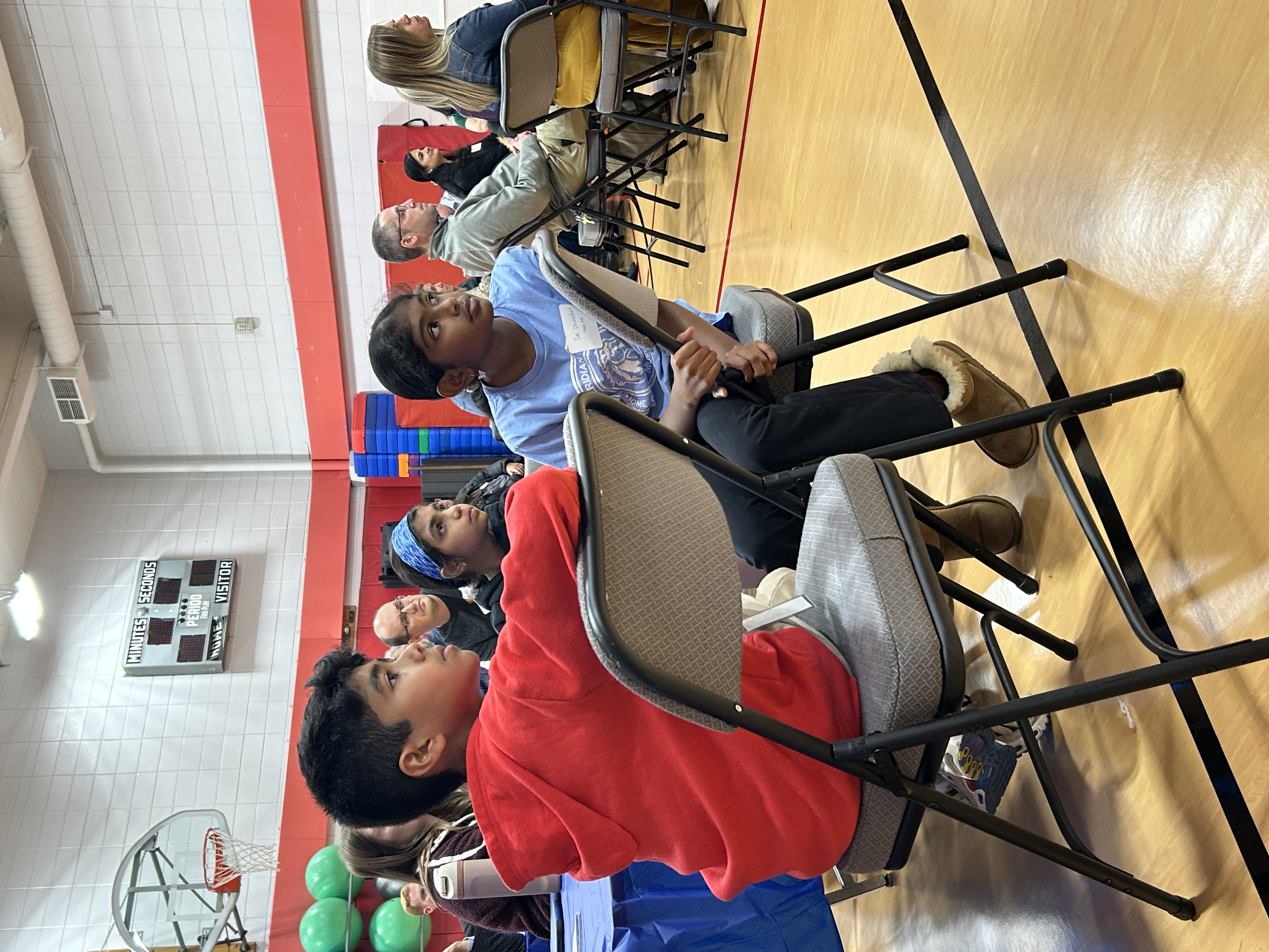 Students sitting in chairs.