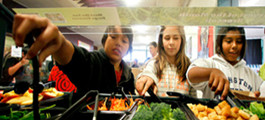 Kids grabbing food in cafeteria