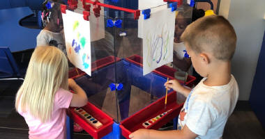 Students painting at an easel