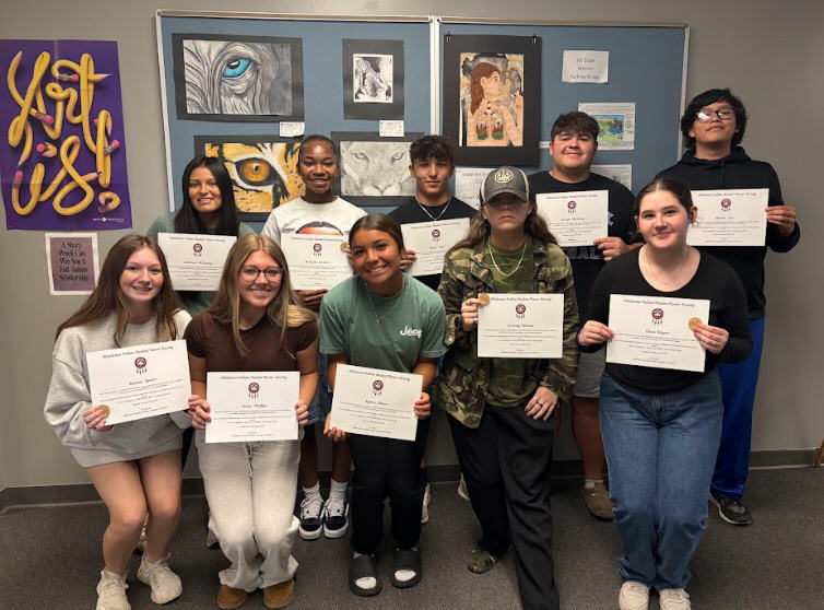 Students holding certificates