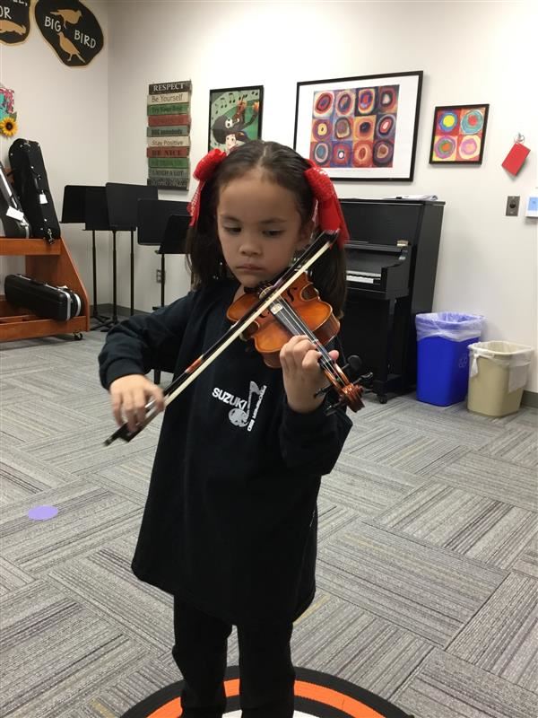 Kid playing the violin