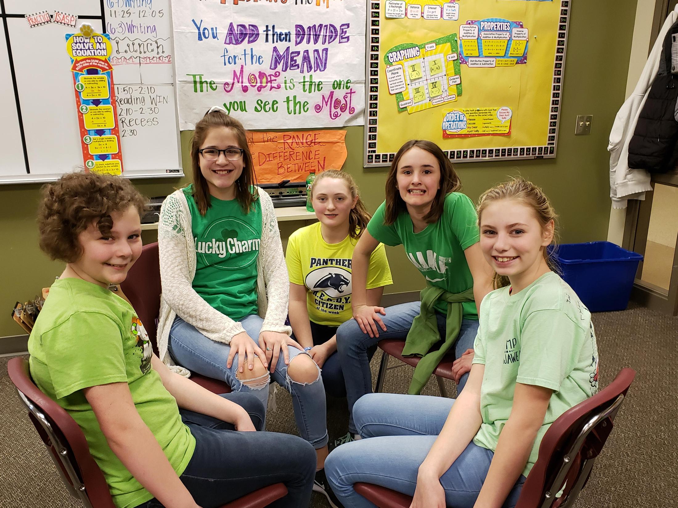 students in green shirts group photo