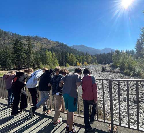 Students looking at a river