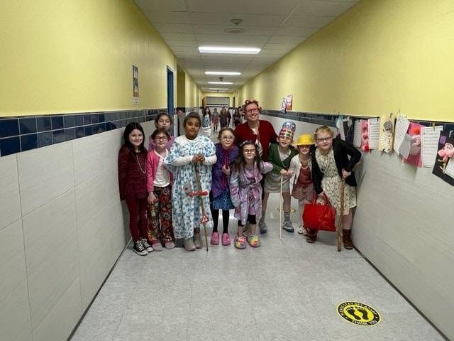 Students in the hallway dressed as old people