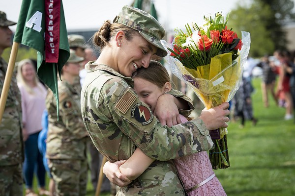 soldier hugging child