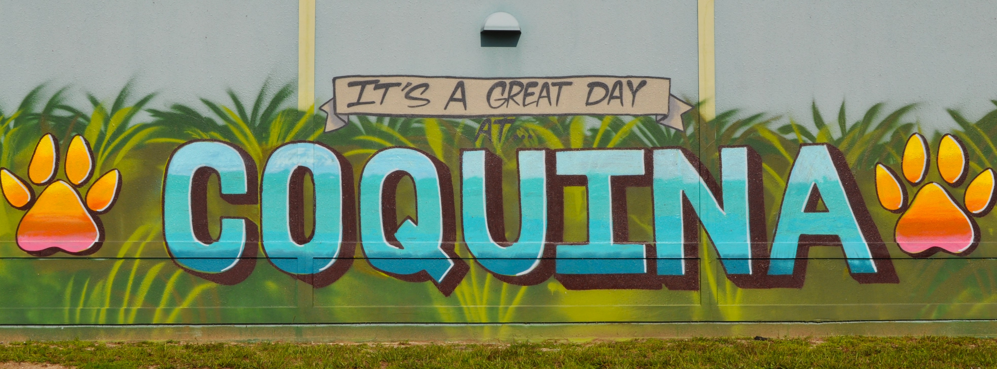 A mural on the wall for Coquina Elementary that says it's a great day.