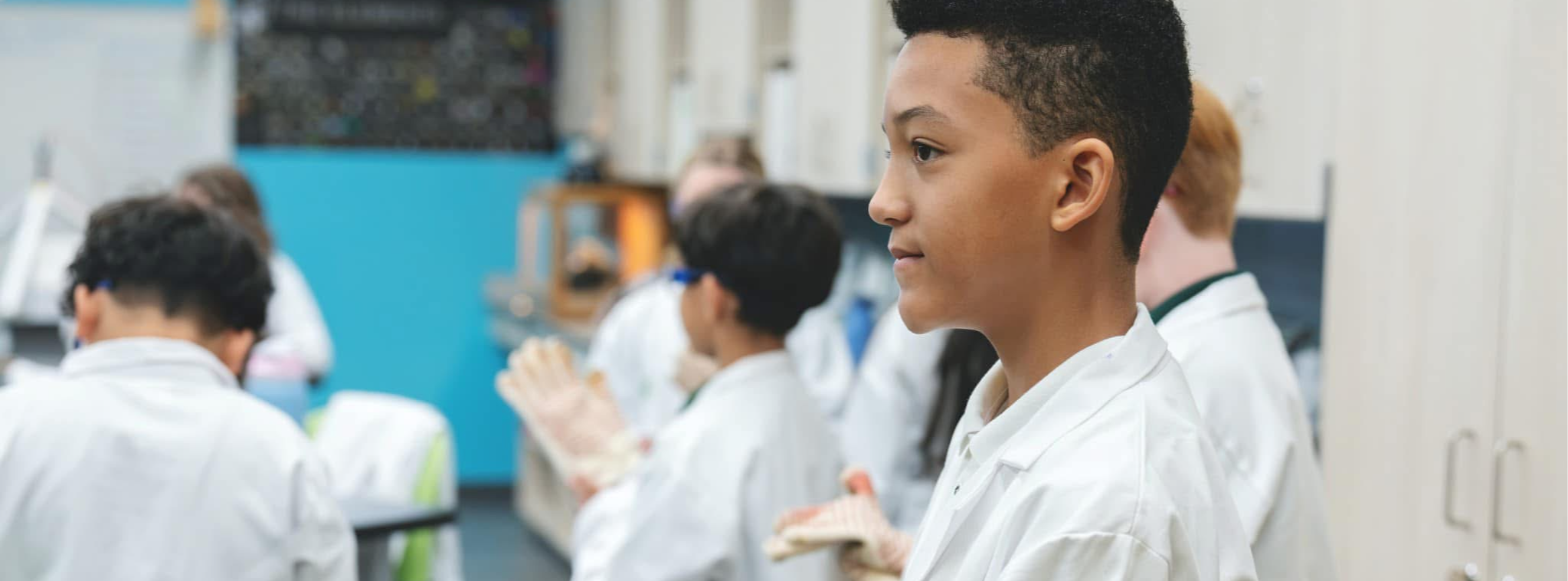 student suiting up for science