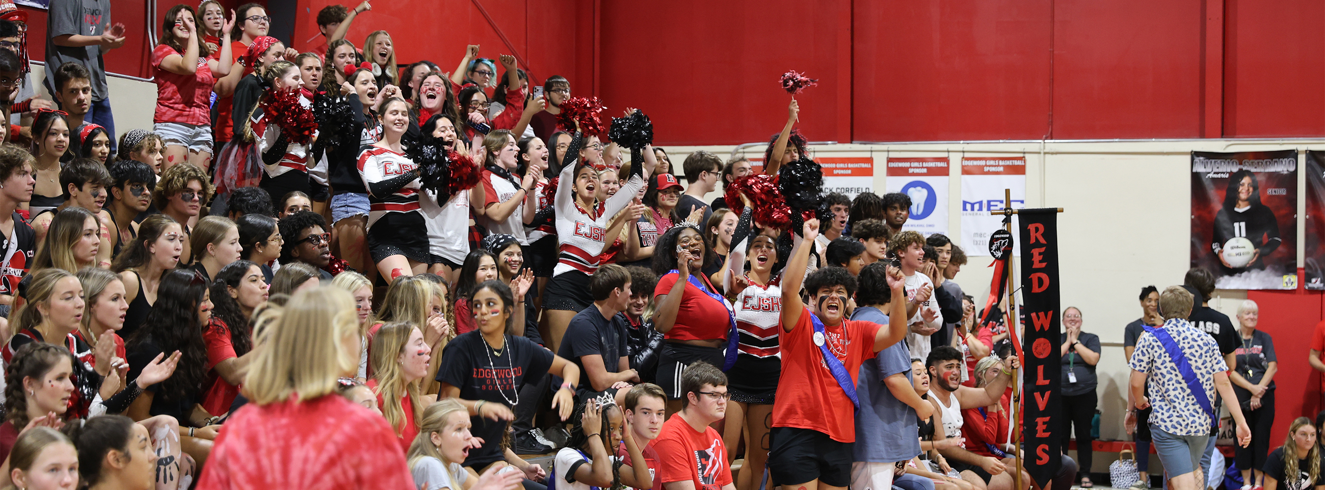 Students cheering in the gym during a pep rally