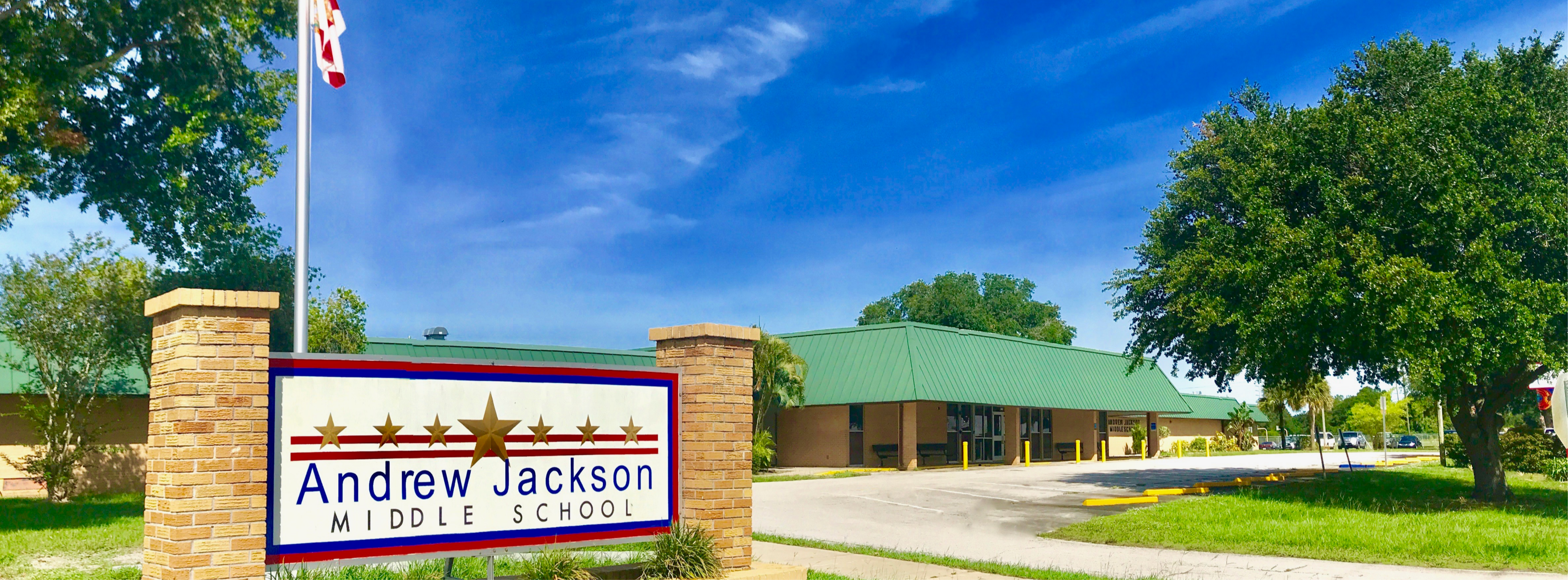 Street view photo of front of school building and Andrew Jackson Middle School sign.