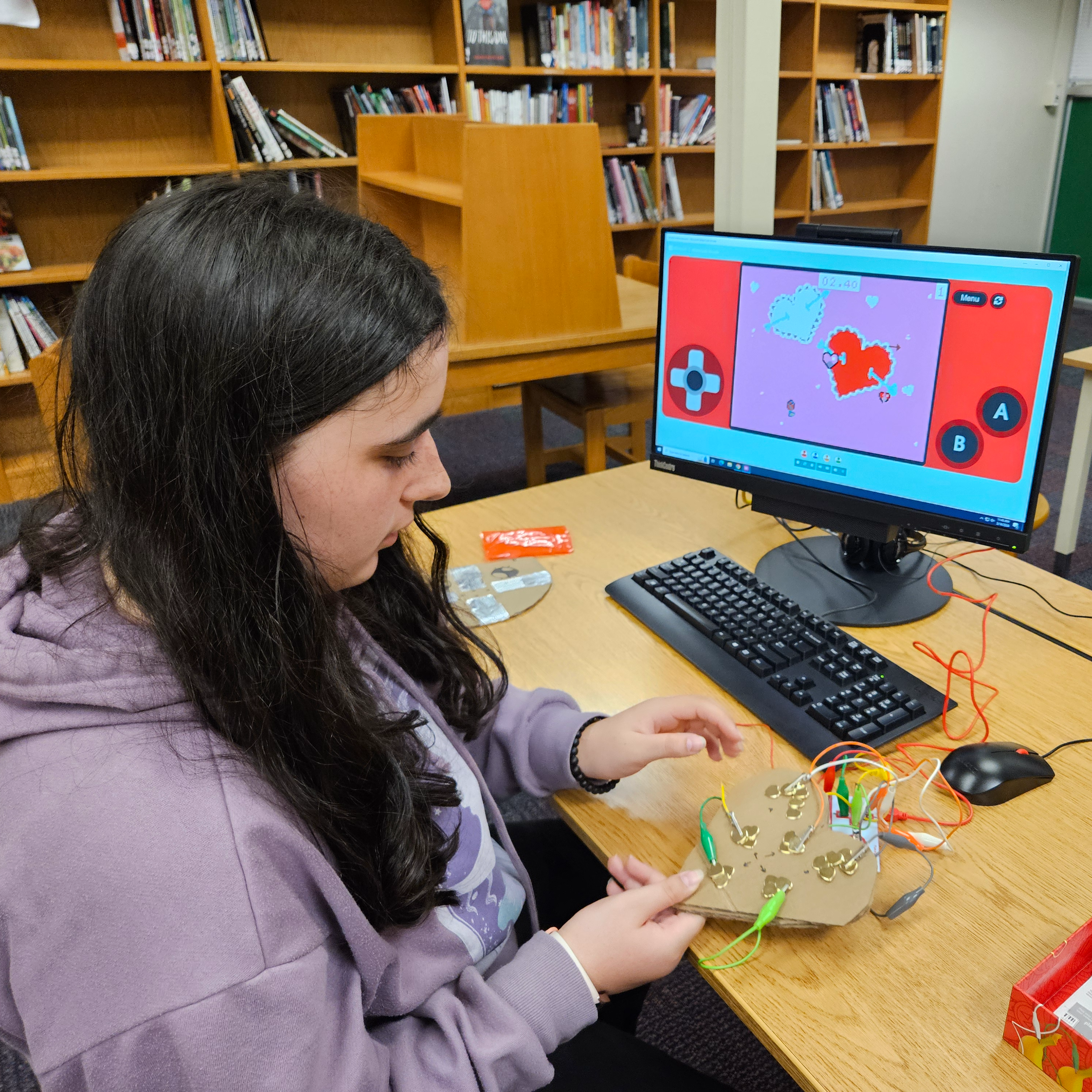 Student working on game controller