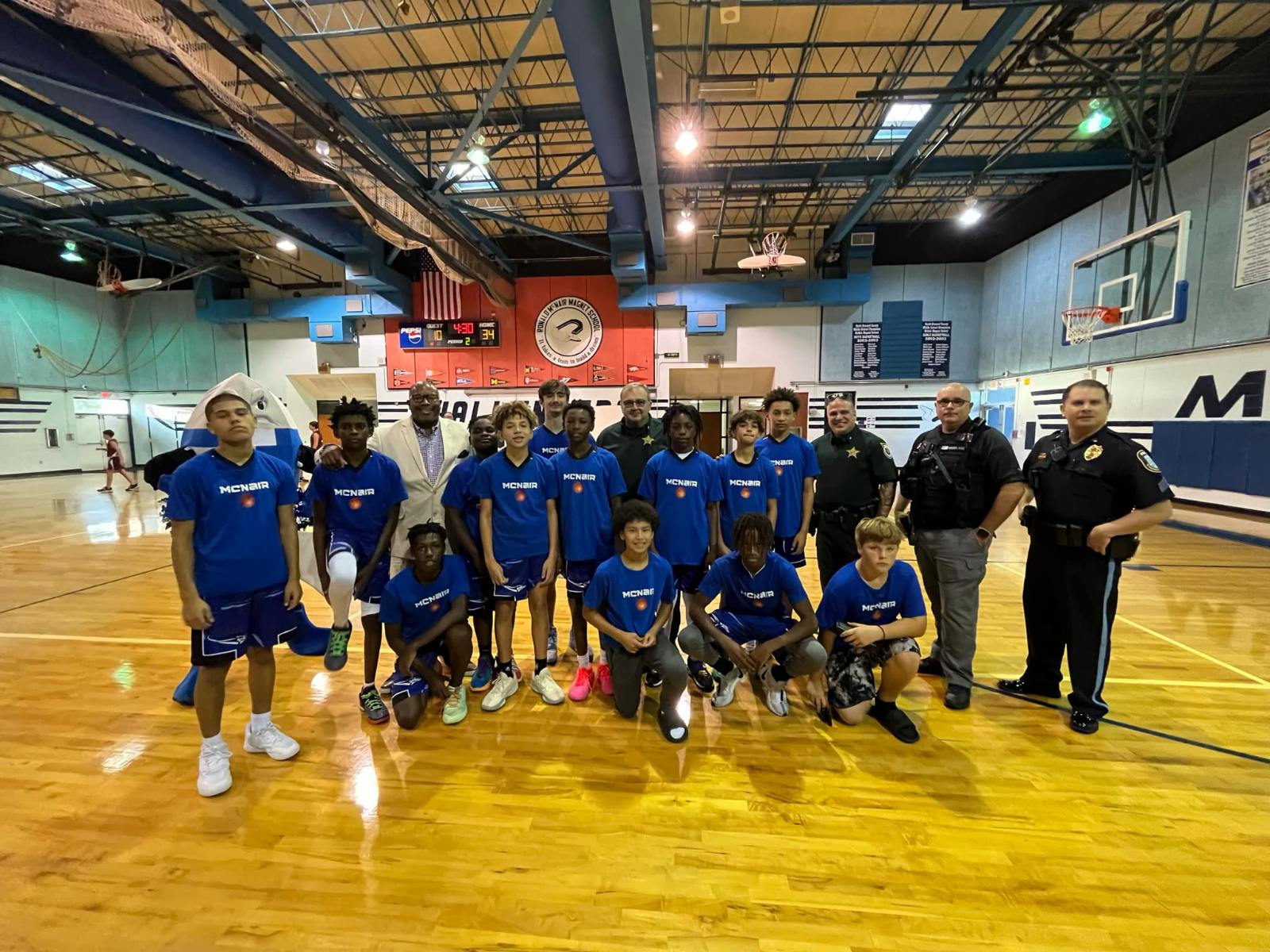 Boys basketball steam with police