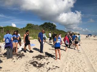 students cleaning the beach 