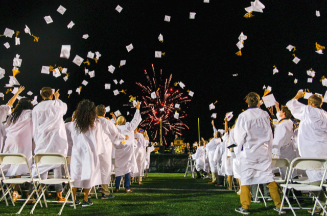 Graduation picture with fireworks