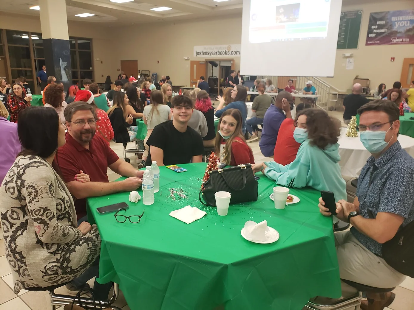 Students and Family sitting on round table at an event at Viera HS 
