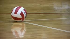 Photo of volleyball on court