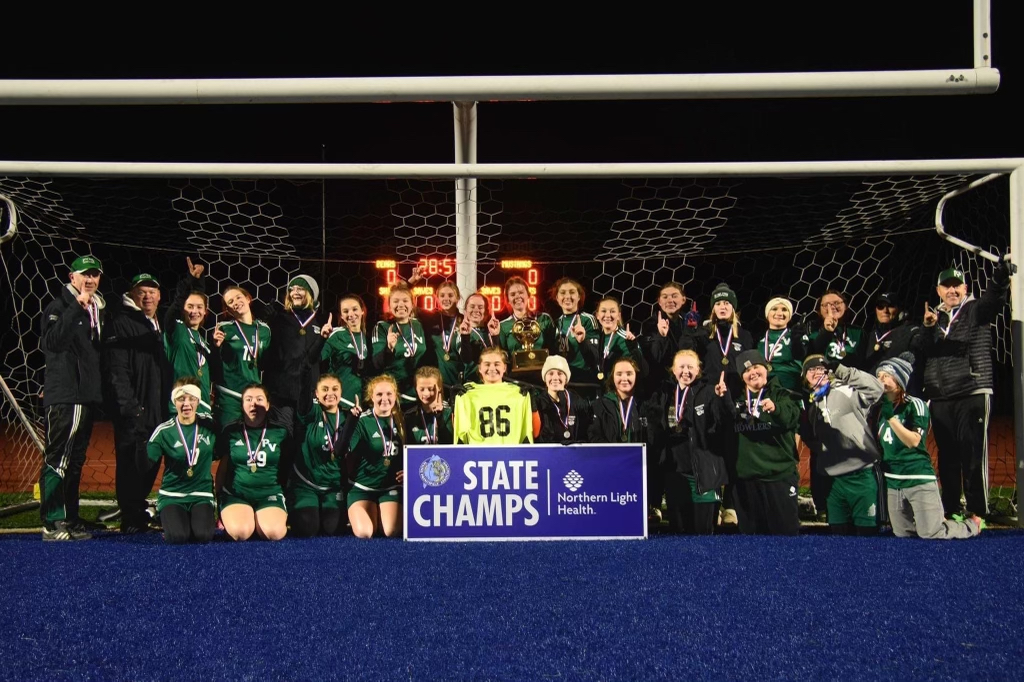 Girls Soccer Team posing for a team picture after winning the Class D State Championship