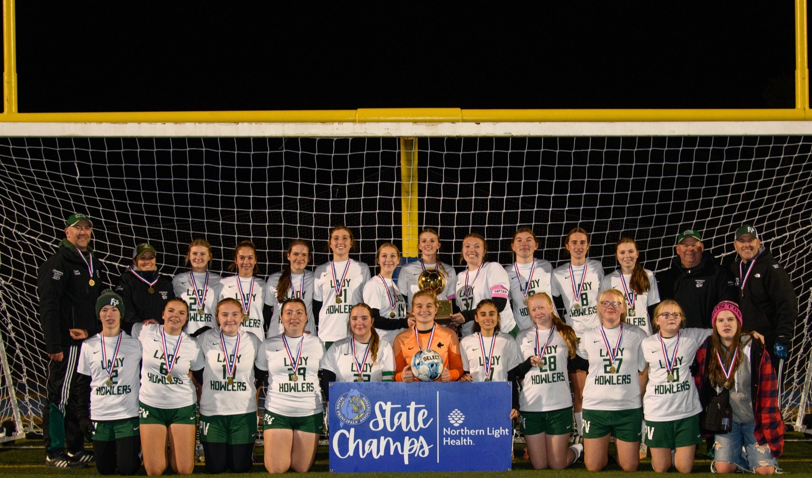 Girls Soccer Team posing for a team picture after winning the Class D State Championship